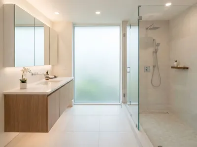 Compact bathroom remodel with space-saving wall-mounted vanity